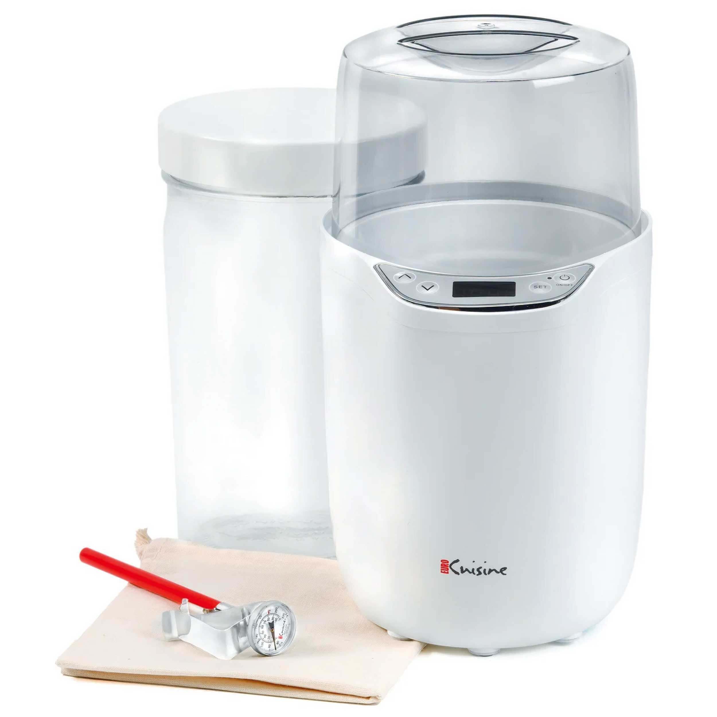 a photo of a juicer with a bottle next to it