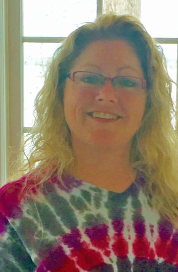 Headshot of woman in tie dye shirt