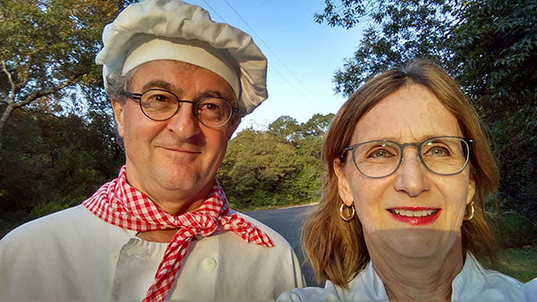 Selfie of husband and wife in baker uniforms