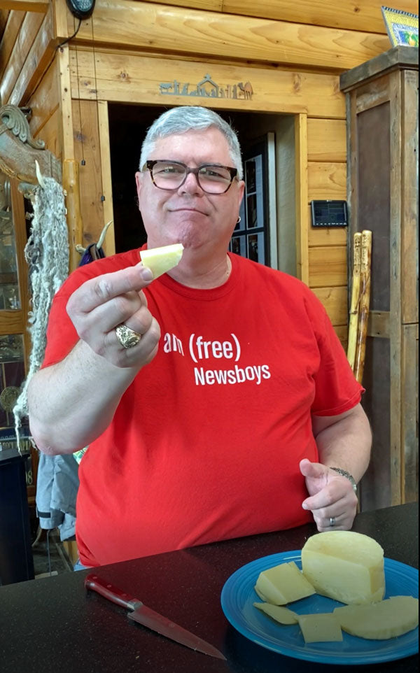 A man holding cheese.