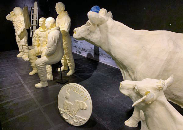 butter sculptures of people and cows