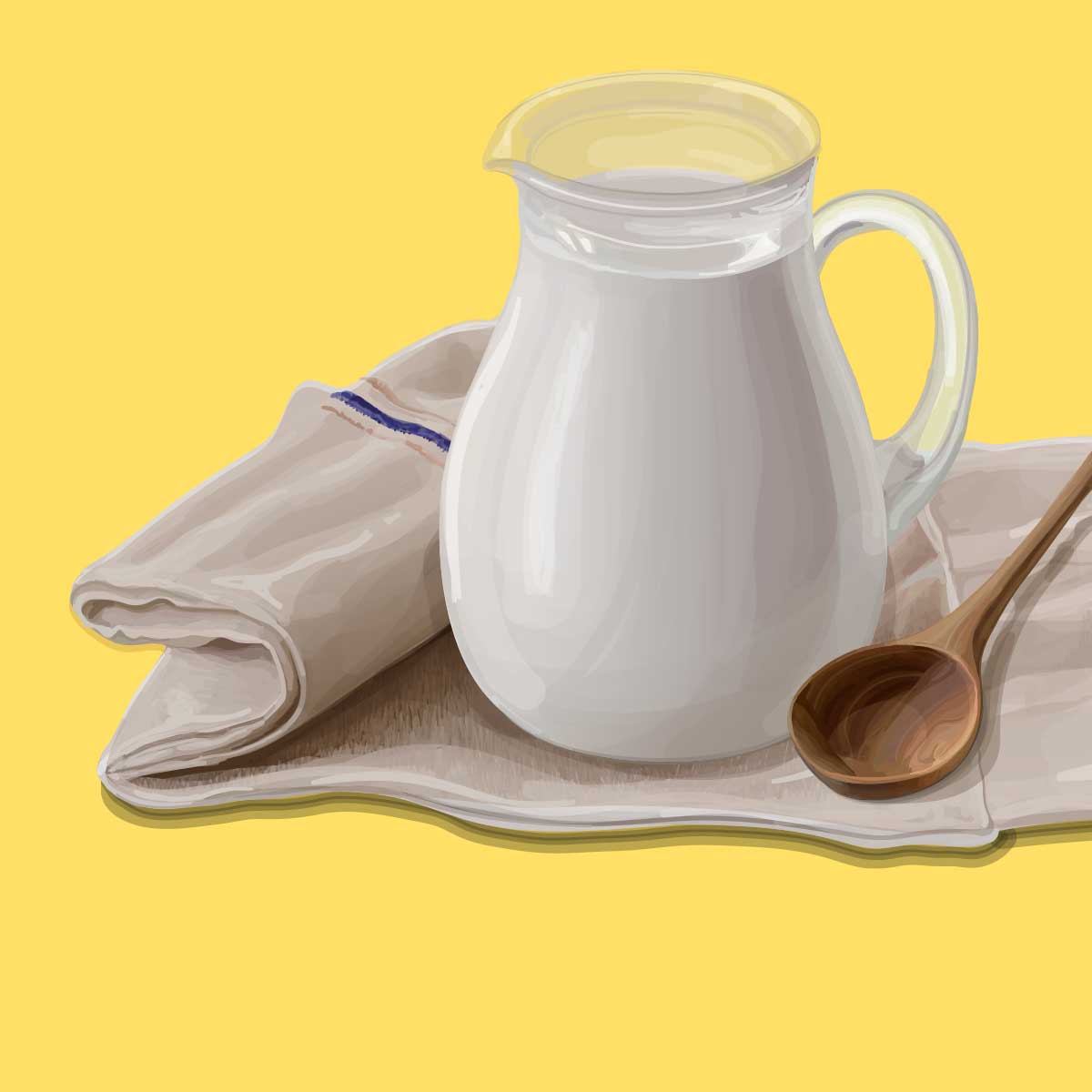 A pitcher of good milk for cheese making placed on a linnen towel next to a wooden spoon and 